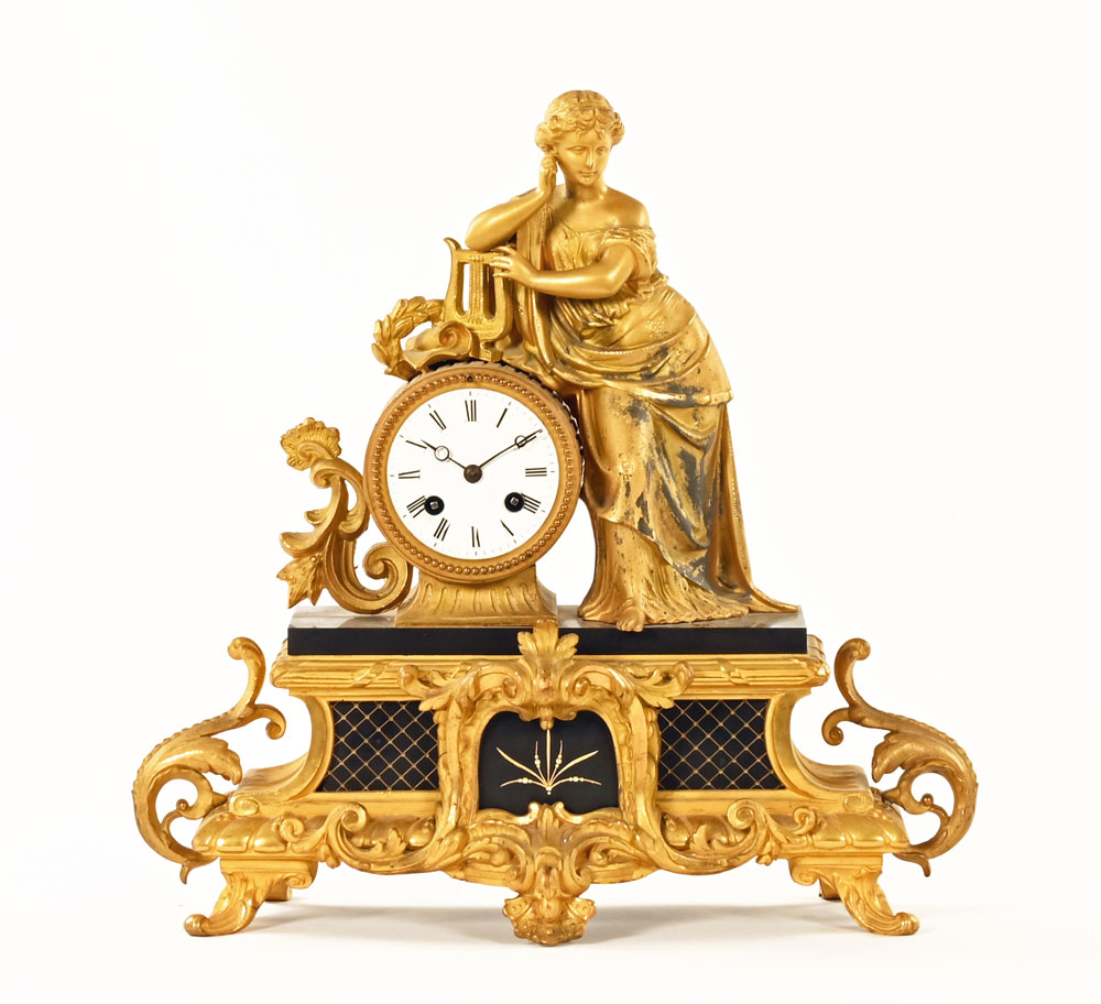 A 19th century French figural mantle clock,