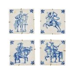 Four 19th century blue and white tiles, soldiers on horseback. Each 15 cm square.