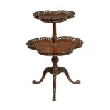 An Edwardian mahogany two tier shaped occasional table,