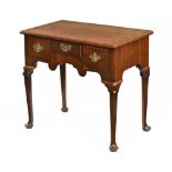 A George III mahogany lowboy, with moulded edge and rounded corners,