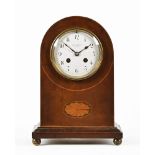 An Edwardian inlaid mahogany mantle clock by Winsor Bishop Norwich. Height 29 cm, width 20 cm.