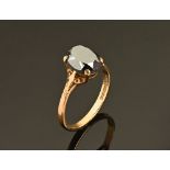 A 9 ct gold ring with deep purple glass stone, Size Q, 3 grams gross.