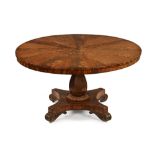 A William IV flame veneered mahogany breakfast table with segmented top. diameter 137 cm.