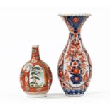 A large Japanese Imari porcelain Meiji period fluted vase, 39 cm high and a bulbous vase.