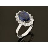 An 18 ct white gold fine sapphire and diamond cluster ring, sapphire +/- 4.02 carats.