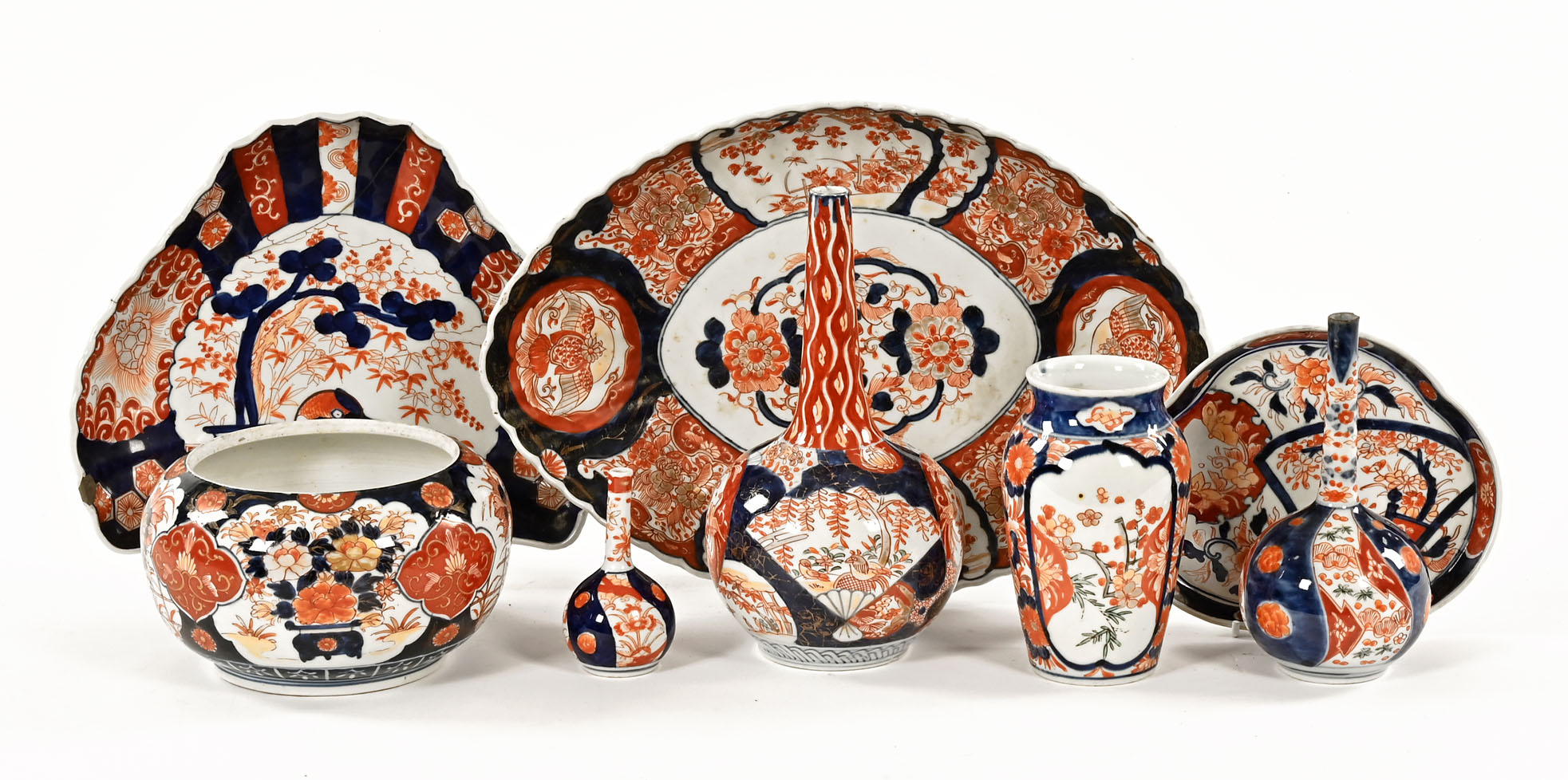 A collection of Japanese Imari porcelain, Meiji period, to include three bottle vases,