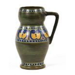 A Gouda jug, retailed by Liberty. Height 20 cm.