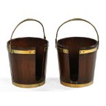 A pair of Georgian mahogany Irish plate buckets, each with brass handle and being brass bound.