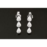 A pair of 18 ct white gold earrings, set with diamonds weighing +/- .15 carats.