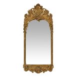 A gilt framed moulded wall mirror, with shell moulding to pediment. Height 100 cm, width 44 cm.