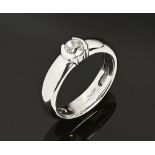 An 18 ct white gold ring with a semi rubover set old cut diamond, weighing +/- .52 carats.