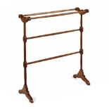 A Victorian mahogany towel rail. Width 73 cm, height 82 cm.