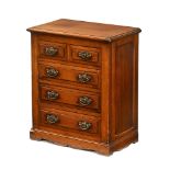 A late Victorian small chest of drawers,
