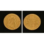 A George I guinea 1715, crowned cruciform shields, sceptres in angles. 8 grams.