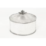 A silver oval caddy of large form, with egg and dart moulded rim and lip.