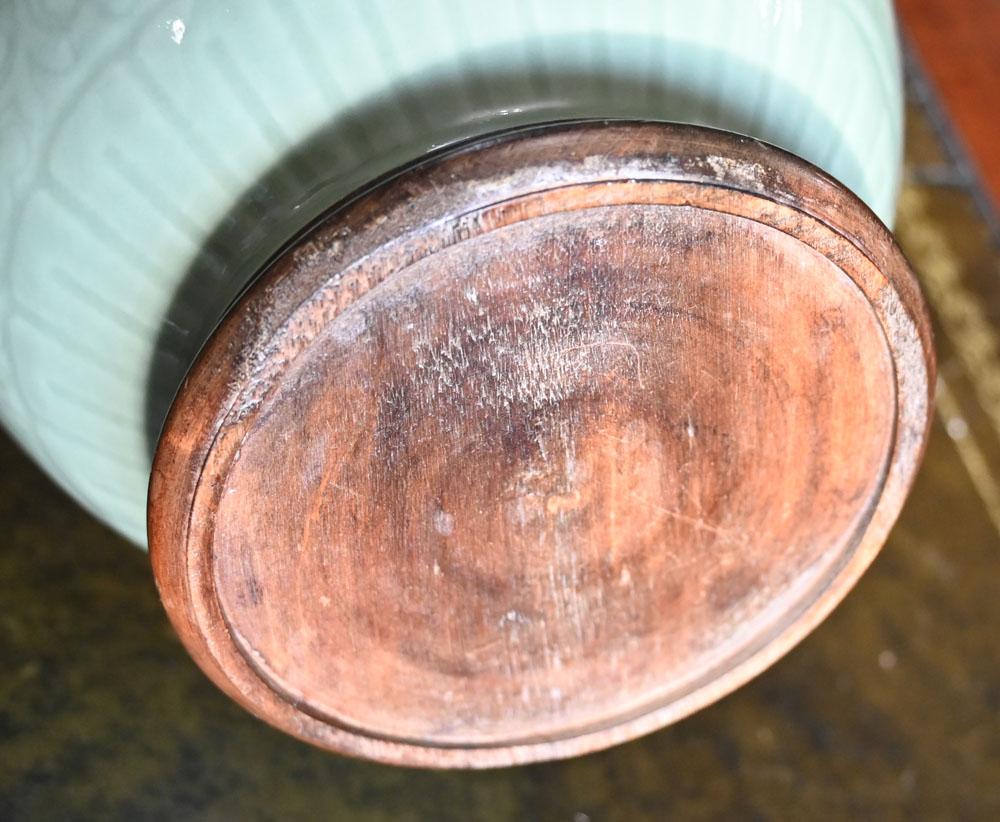 A Chinese celadon vase, with integral circular wooden stand. Height 38 cm. - Image 6 of 6