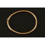 A 9 ct gold bangle. 5.9 grams.