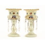 A pair of Victorian glass lustres, hand painted with floral sprays and with faceted glass drops.