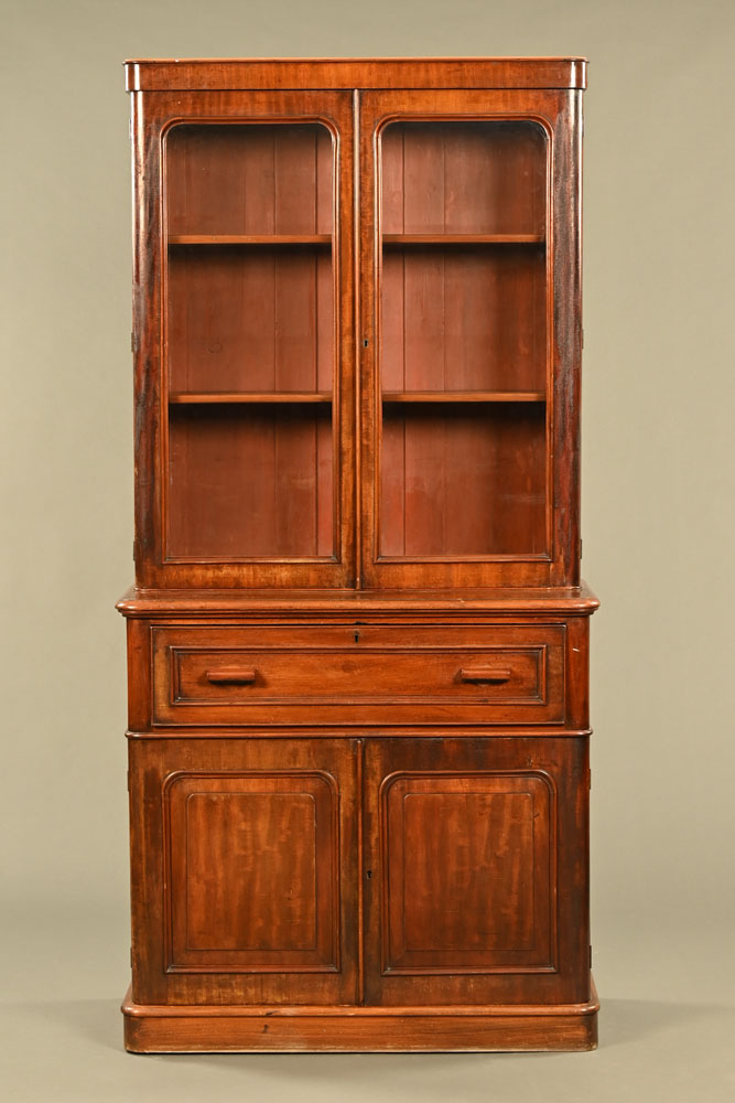 A Victorian mahogany secretaire bookcase, with detachable cornice to the glazed upper section,