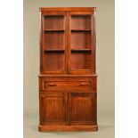 A Victorian mahogany secretaire bookcase, with detachable cornice to the glazed upper section,