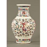 A 19th century Chinese vase, decorated with dragons and repeating design,