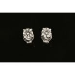 A pair of 18 ct white gold stud earrings, set with diamonds weighing +/- .53 carats.