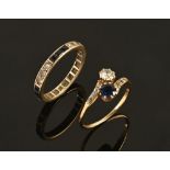 An 18 ct gold sapphire and diamond crossover ring, with diamond set shoulders, size O,