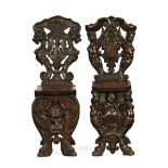 A pair of 19th century Italian walnut sgabello form hall chairs.