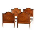 A pair of Edwardian inlaid mahogany single beds,