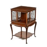 An early 20th century mahogany square revolving bookcase stand, with cabriole legs and pad feet.