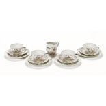 A Japanese eggshell part tea service, with settings for four together with a milk jug,
