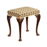 A mahogany Queen Anne Style footstool,