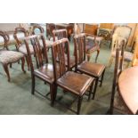 Four oak leather seated dining chairs