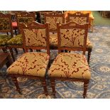 Four oak chairs with matching tapestry upholstery