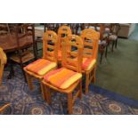 Four modern pine dining chairs with striped upholstered seats and another chair