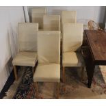 Six cream padded dining chairs