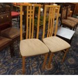 Pair of pale wood tall backed chairs