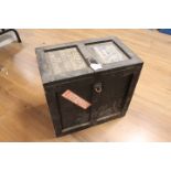Wooden storage trunk with advertising stickers and three camera plates