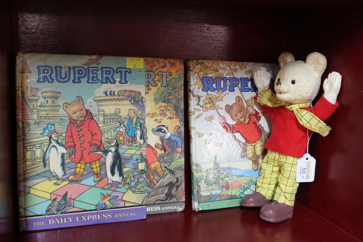 Three Rupert annuals and foam Rupert Bear