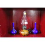 Glass bottomed handheld oil lamp and pair of blue glass vases