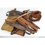 A Brady 12 bore leather cartridge belt and a Brady leg of mutton canvas and leather shotgun case,