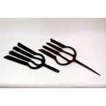Two antique wrought iron eel forks (fishing spears) the longest measuring 43 cm long,