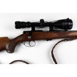 An Anschutz cal 22 LR bolt action rifle, with a five round magazine, leather sling,