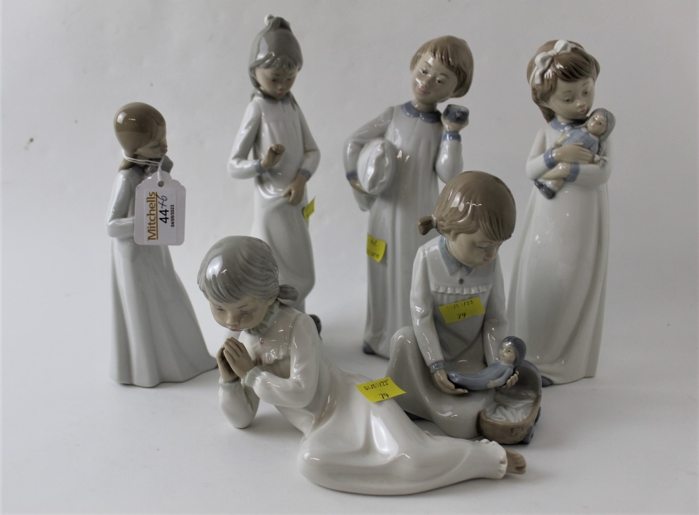 Six Nao figurines