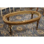 Heavily carved continental style gilt effect coffee table (centre marble missing)