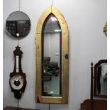 Arched gilded wood framed mirror with stained glass border,