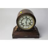 Wooden mantle clock with scroll decoration and key