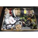 Tin of costume jewellery, necklaces,