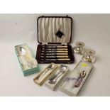 Collection of boxed and unboxed cutlery, knives, teaspoons, candlesticks,