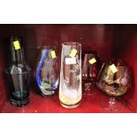 Two large coloured glass brandy balloons,